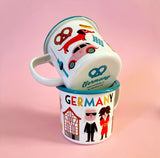 Emaille Tasse GERMANY von OMM Design mit typisch deutschen Motiven als Souvenir aus Deutschland lustig